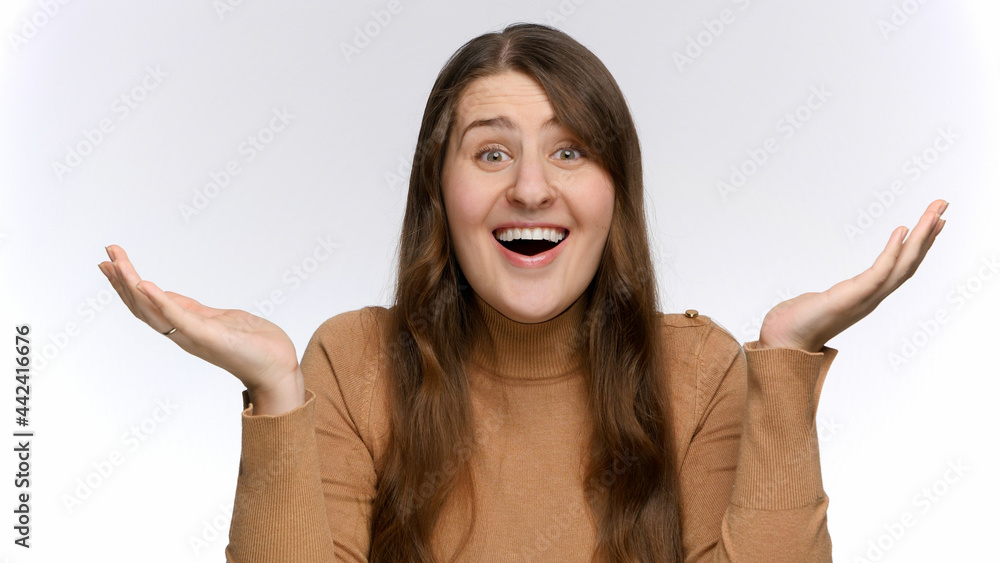 Laughing amazed and shocked woman opens mouth and shakes head. Positive emotions and surprised face expression Laughing amazed and shocked woman opens mouth and shakes head. Positive emotions and surprised face expression
