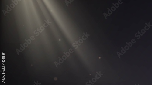 Dark room with golden rays of light or sunlight