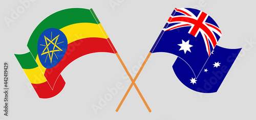 Crossed and waving flags of Ethiopia and Australia