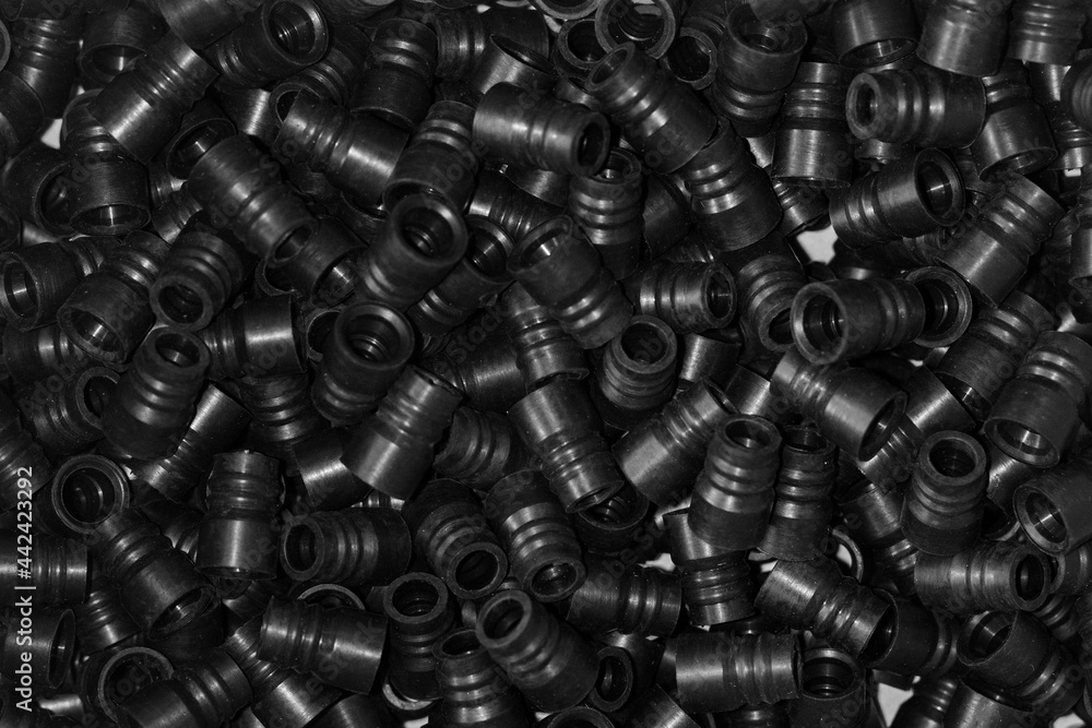 Lots of plastic black fittings for connecting water pipes or plastic pipes. Background, texture. Industrial equipment. Lots of plastic black fittings for connecting water pipes or plastic pipes. Background, texture. Industrial equipment.