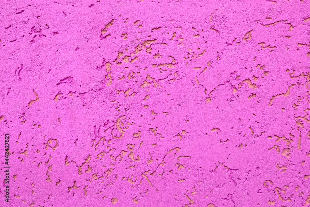 painted textured cement wall in bright purple color painted textured cement wall in bright purple color