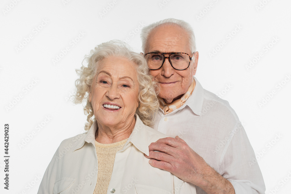 smiling elderly couple in casual clothes looking at camera isolated on white smiling elderly couple in casual clothes looking at camera isolated on white
