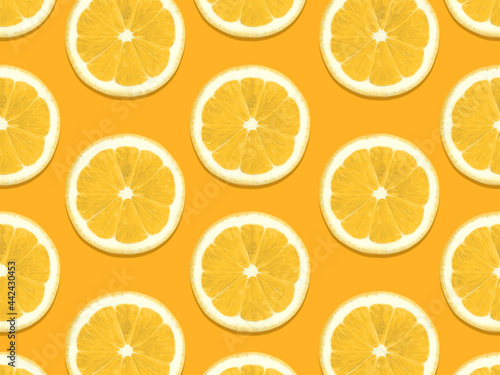 Seamless pattern with lemons Top view photo Halved fresh citrus fruits on orange backdrop