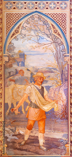 VIENNA, AUSTIRA - JUNI 24, 2021: The fresco of Parable of the sower in the Votivkirche church by brothers Carl and Franz Jobst (sc. half of 19. cent.). photo