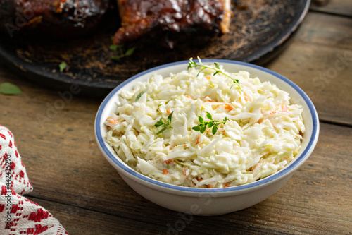 Coleslaw salad served with BBQ meal, traditional side photo