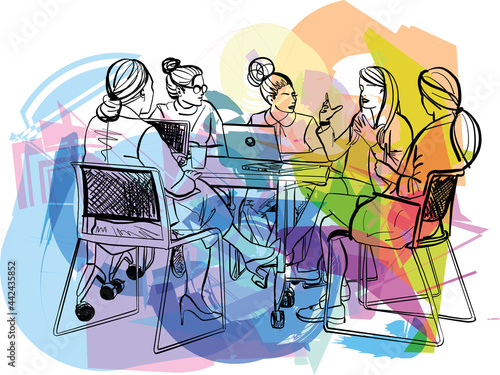 Female creatives in a meeting room listening to their colleague making an informal presentation