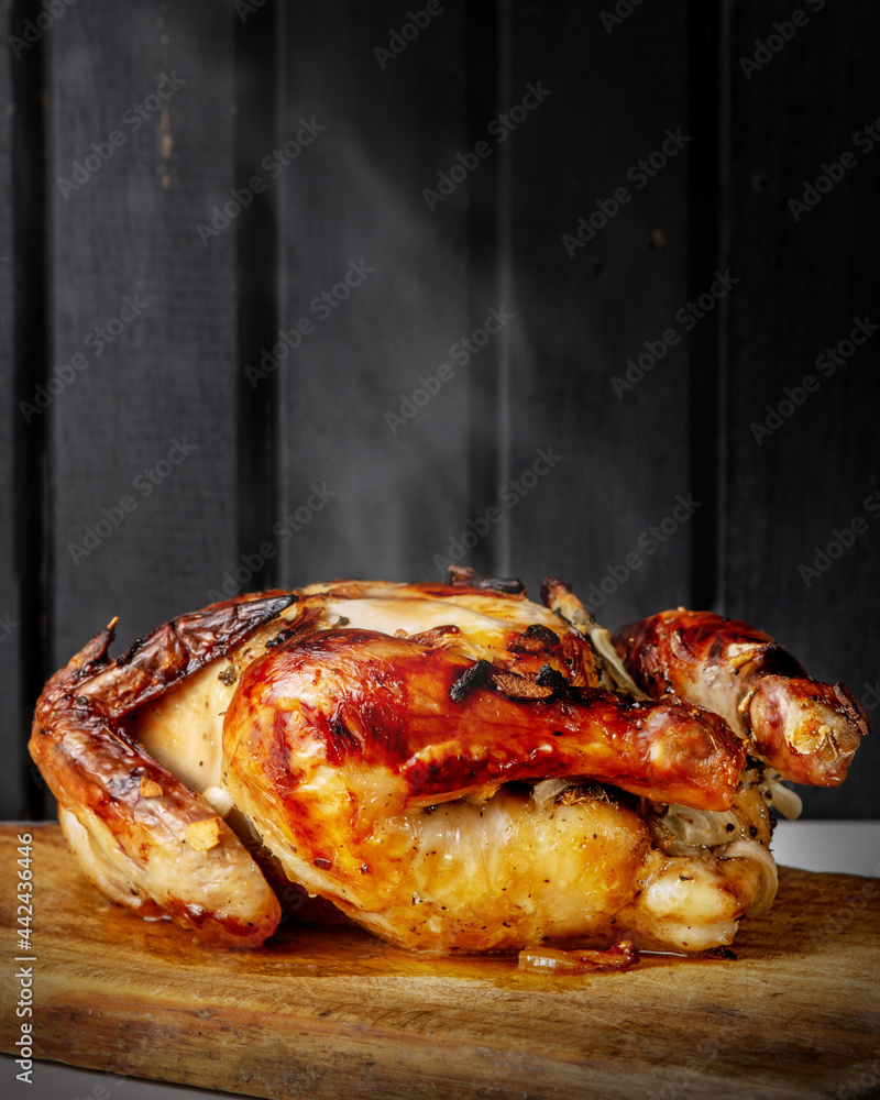 custom made wallpaper toronto digitalOven Baked whole crispy chicken on top of a wooden cutting board seasoned with garlic and onions