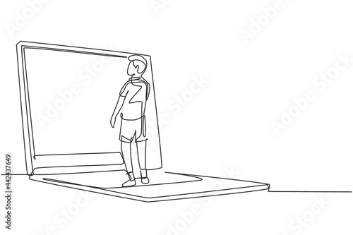 Single continuous line drawing male junior high school student writing on giant laptop screen like he was writing on whiteboard. Learning concept. One line draw graphic design vector illustration