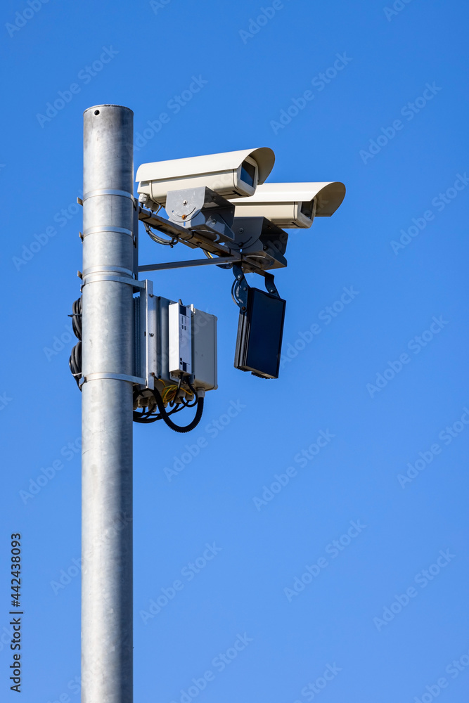 CCTV, Security road camera for traffic control on the street on blue sky CCTV, Security road camera for traffic control on the street on blue sky