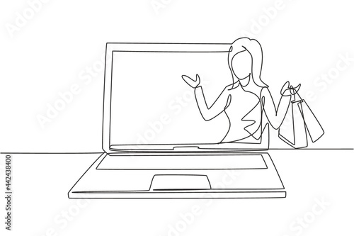 Single one line drawing young woman coming out of laptop screen holding shopping bags. Sale, digital lifestyle and consumerism concept. Modern continuous line draw design graphic vector illustration
