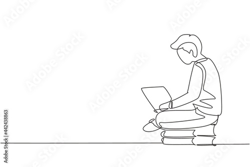 Single continuous line drawing young male studying with laptop and sitting on pile of books. Back to school, intelligent student, online education. One line draw graphic design vector illustration