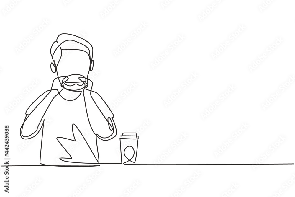 Single one line drawing young boy having hamburger meal with hands around table. Enjoy and happy lunch when hungry. Delicious fast food. Modern continuous line draw design graphic vector illustration
