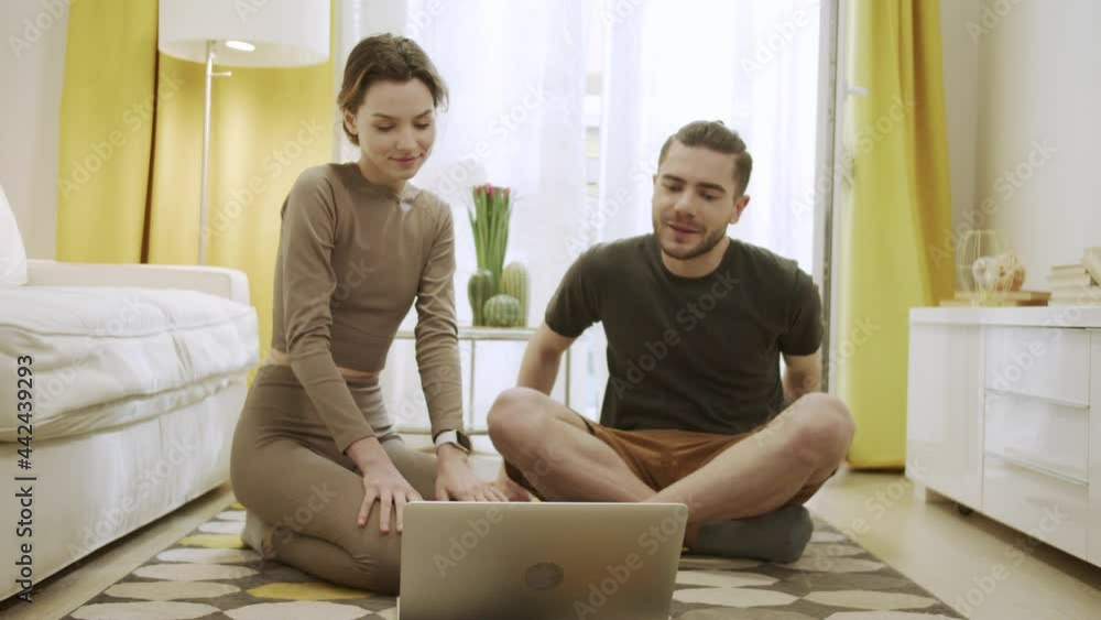 Two friends are starting to watch something on the computer Two friends are starting to watch something on the computer