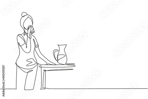 Single one line drawing young woman standing and drinking water in a glass from a jug. Take a break while cleaning house. Happy person. Modern continuous line draw design graphic vector illustration