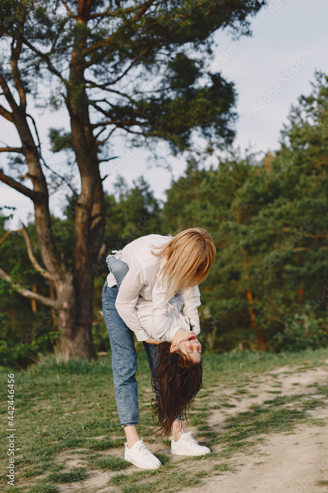 Elegant mother with daughter in a summer forest Elegant mother with daughter in a summer forest
