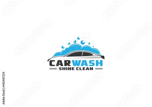 logo for a car wash with an illustration of a car full of foam