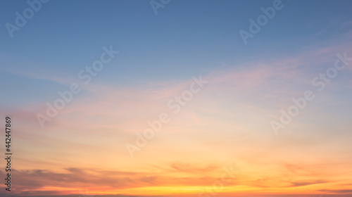 Beautiful Vivid sky painted by the sun leaving bright golden shades.Dense clouds in twilight sky in winter evening.Image of cloud sky on evening time.Evening Vivid sky with clouds. © Chalermwoot