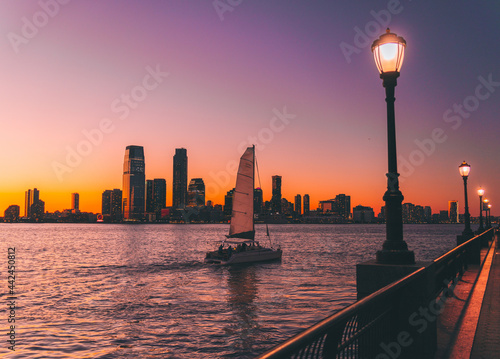 Canvas Print sunset over the river panorama travel boat horizon new jersey lights colors view