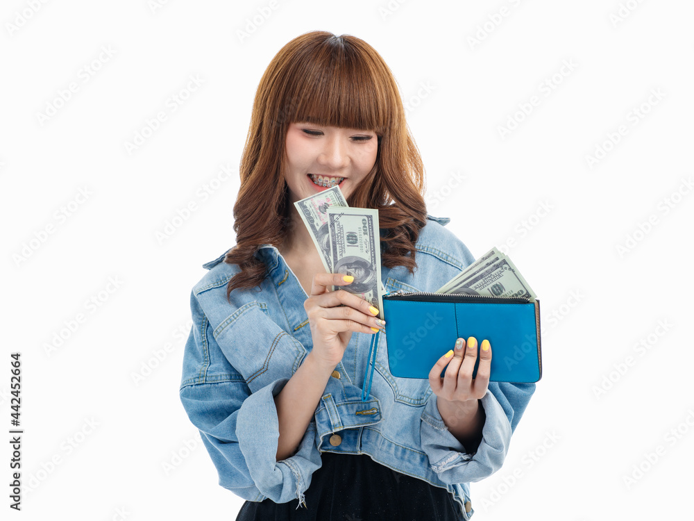 Woman collects American banknotes in blue wallet.. Woman collects American banknotes in blue wallet..