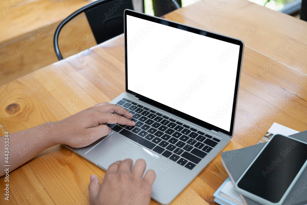 Businesswoman working with computer laptop at wooden office desk. Businesswoman working with computer laptop at wooden office desk.