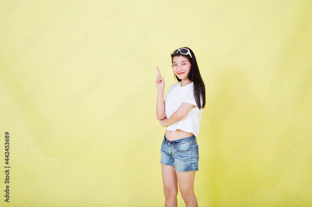 Asian woman smiling and pointing Asian woman smiling and pointing