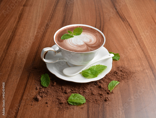 hot chocolate cafe mocha drink with mint leaf in beautiful England white cup hot coffee beverage menu