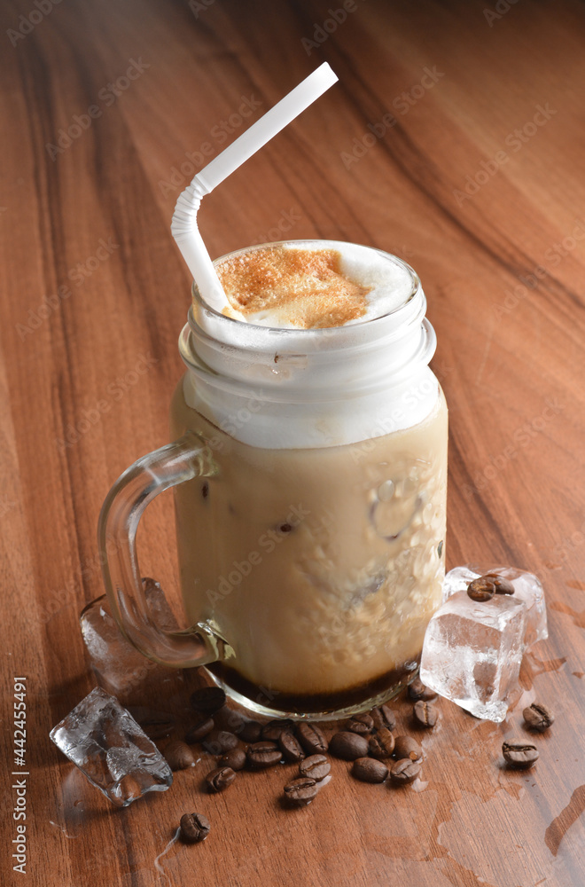 ice cafe mocha latte drink with bubbles and coffee bean in glass on wood table coffee beverage menu ice cafe mocha latte drink with bubbles and coffee bean in glass on wood table coffee beverage menu