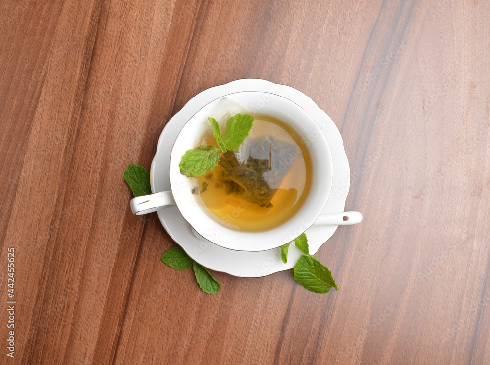 hot moroccan mint leaf tea bag drink in beautiful England design white cup hot healthy beverage menu hot moroccan mint leaf tea bag drink in beautiful England design white cup hot healthy beverage menu