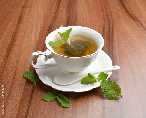 hot moroccan mint leaf tea bag drink in beautiful England design white cup hot healthy beverage menu