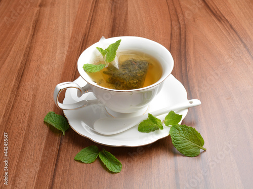 hot moroccan mint leaf tea bag drink in beautiful England design white cup hot healthy beverage menu