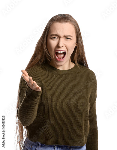 Angry young woman on white ...