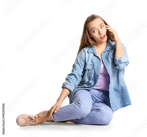 Young woman talking by mobi...