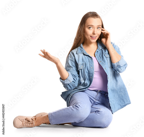 Young woman talking by mobi...