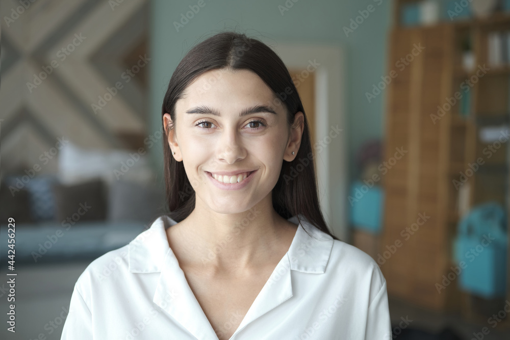 A serene, beautiful woman with clear skin and a beautiful smile smiling A serene, beautiful woman with clear skin and a beautiful smile smiling
