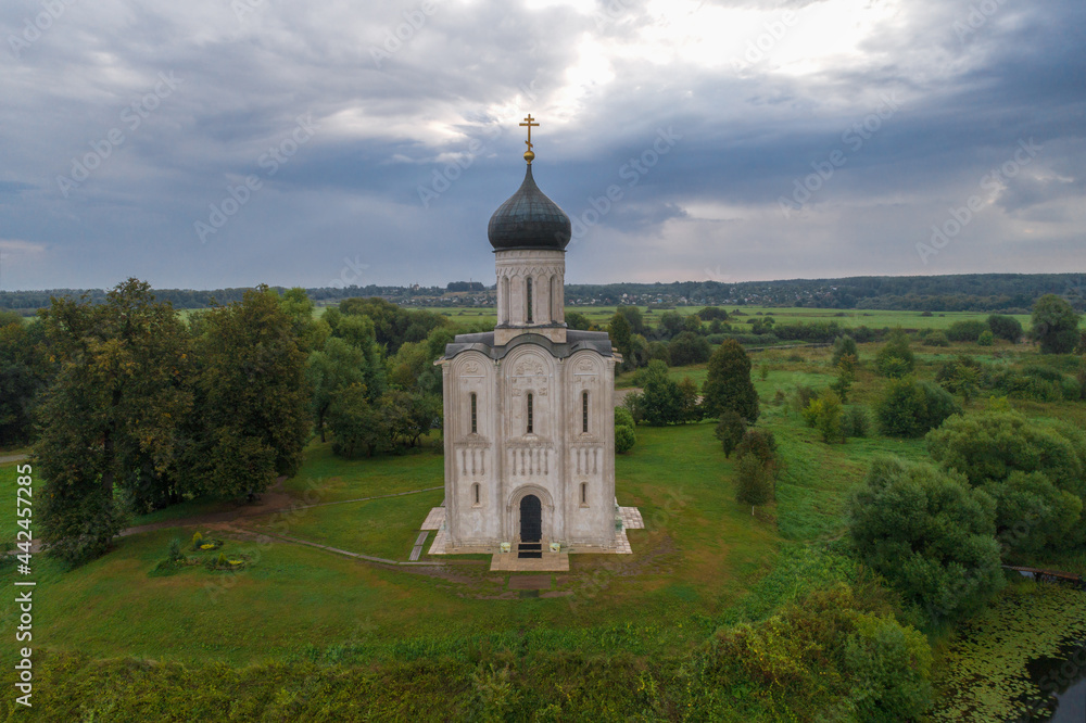 The ancient Orthodox Church of the Intercession on the Nerl in the cloudy August morning (shooting from a quadrocopter). Bogolyubovo, Russia