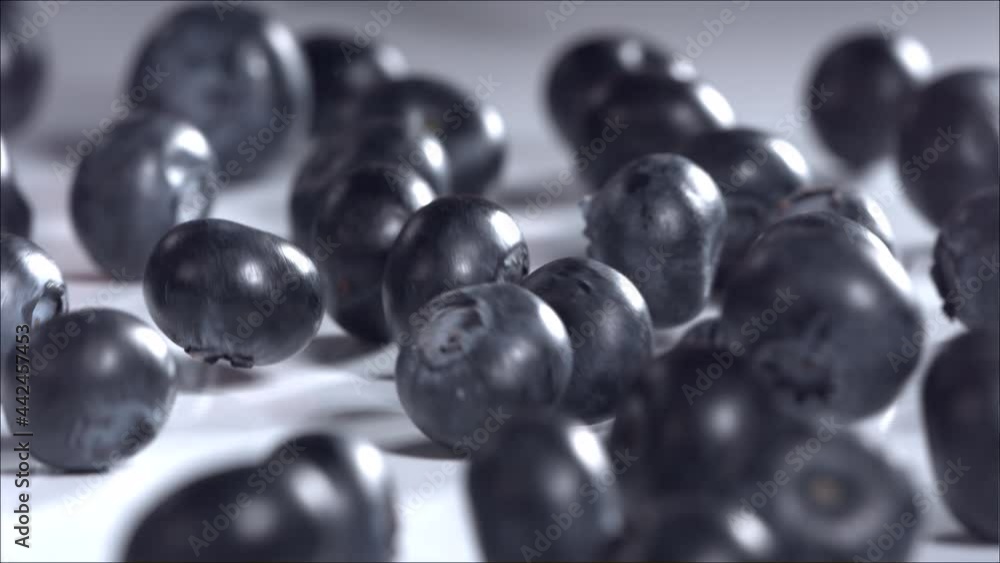 Blueberries Rolling Down on White Background. Slow Motion Blueberries Rolling Down on White Background. Slow Motion