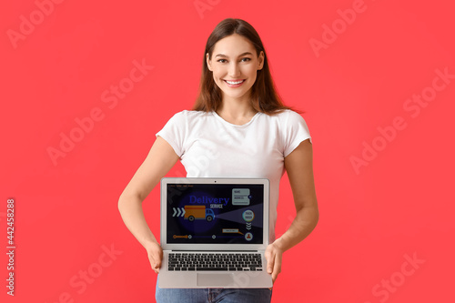 Young woman and laptop with...