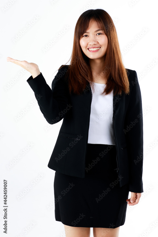 Young and fresh new graduated look Asian businesswoman in black suit show hand palm to present or demonstrate goods and product in advertising gesture on white background Young and fresh new graduated look Asian businesswoman in black suit show hand palm to present or demonstrate goods and product in advertising gesture on white background