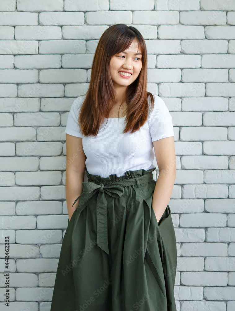 Cheerful Asian woman in stylish apparel in studio Cheerful Asian woman in stylish apparel in studio