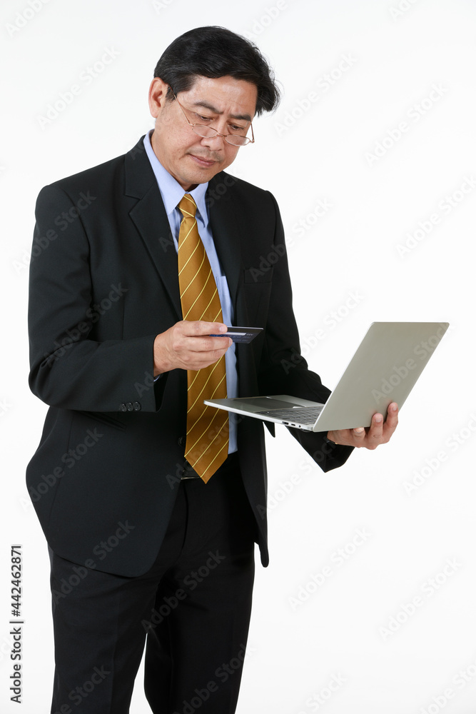 Senior man standing, checking payment his credit card through mobile phone. Seems his wife spent over budget on online shopping discount sale last moment. Senior man standing, checking payment his credit card through mobile phone. Seems his wife spent over budget on online shopping discount sale last moment.