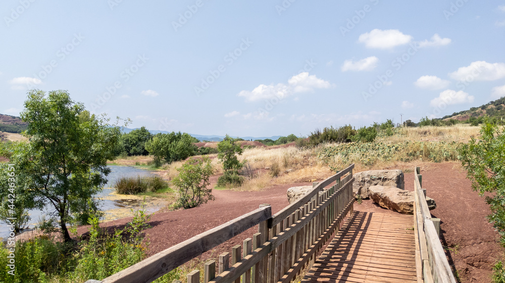 wooden bridge entrance lake lac du Salagou in France wooden bridge entrance lake lac du Salagou in France