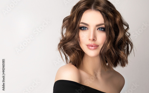 Beautiful model girl with short hair .Woman brunette  with curly hair. Red head .
