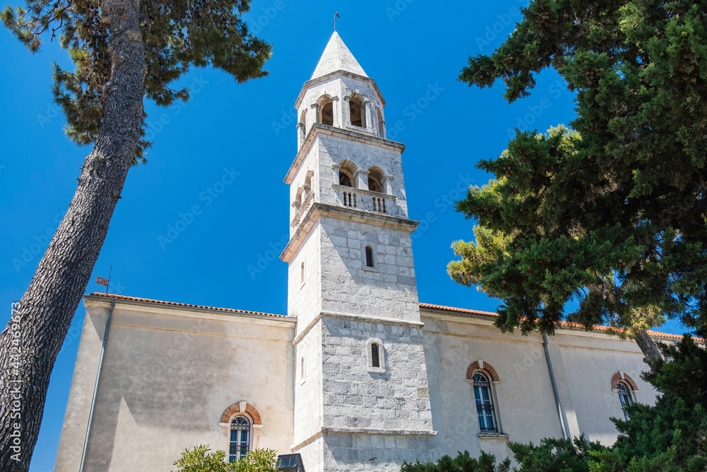 Fototapeta premium Historic architecture in Biograd, bell tower of St. Stosija church, Dalmatia, Croatia