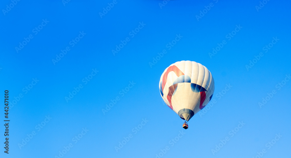 Hot air balloon in the sky. Balloon. Aeronautics. Blue sky. Hot air balloon in the sky. Balloon. Aeronautics. Blue sky.