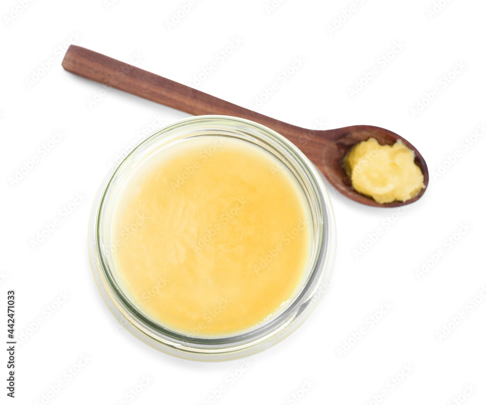 Glass jar and spoon of Ghee butter isolated on white, top view Glass jar and spoon of Ghee butter isolated on white, top view