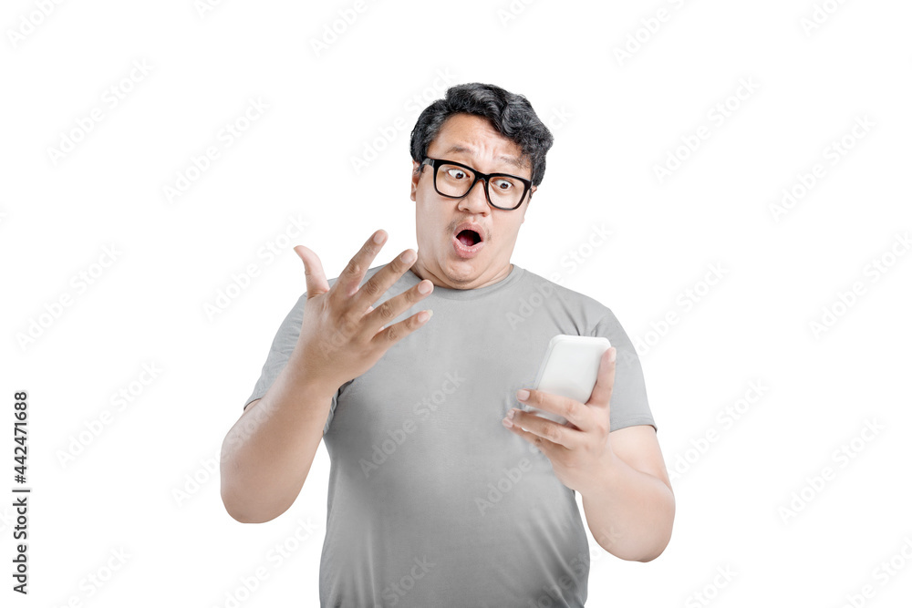Asian man in eyeglasses with unhappy expression Asian man in eyeglasses with unhappy expression