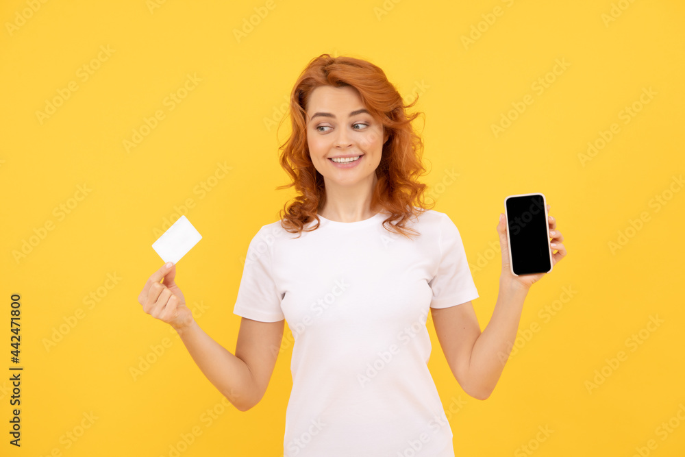 happy woman showing credit or debit card and smartphone to make online shopping, payment online. happy woman showing credit or debit card and smartphone to make online shopping, payment online.