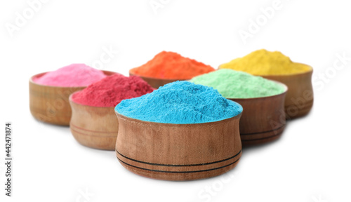 Colorful powder dyes in bowls on white background. Holi festival photo