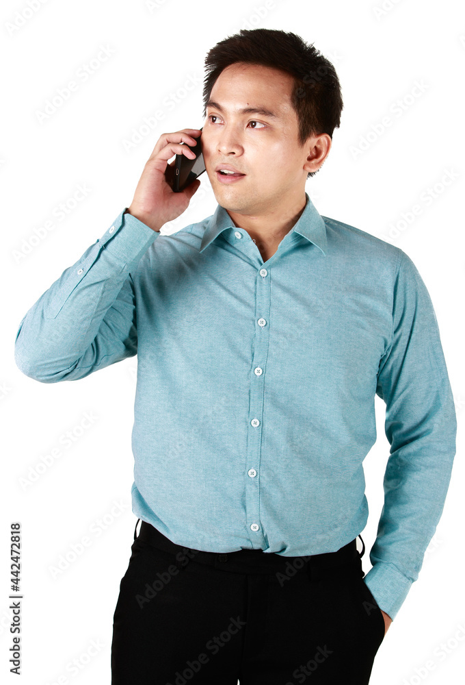 Asian man wearing shirt green holding hand smartphone talking. A handsome talking on the phone in white background at studio. Asian man wearing shirt green holding hand smartphone talking. A handsome talking on the phone in white background at studio.