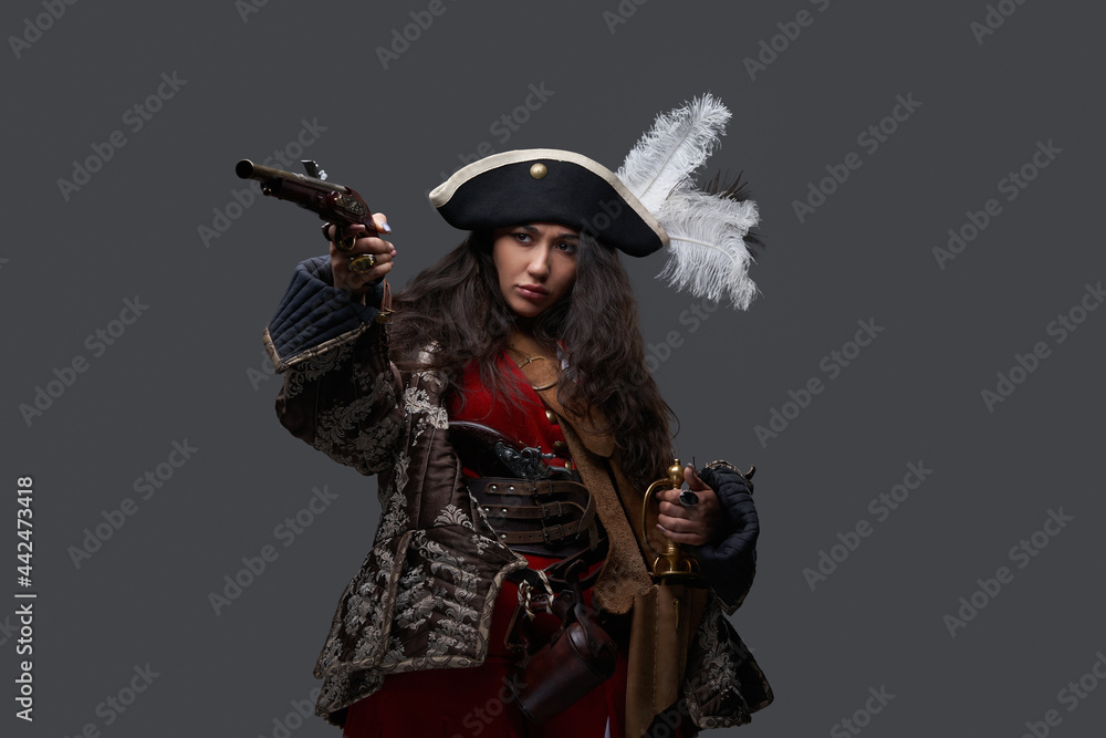 Pirate woman dressed in medieval clothing with gun Pirate woman dressed in medieval clothing with gun